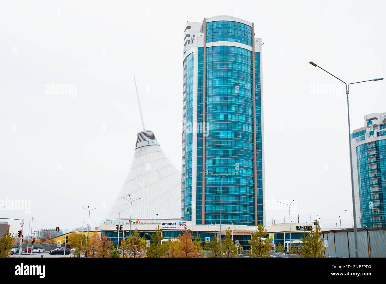 Skyscraper Facade With Blue Windows And Khan Shatyr Shopping And 