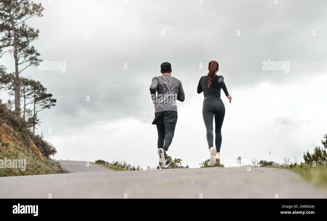 Running Is Second Nature To Us Full Length Shot Of Two Unrecognizable Athletes Bonding Together Running Is Second Nature To Us Full Length Shot Of Two Unrecognizable Athletes Bonding Together