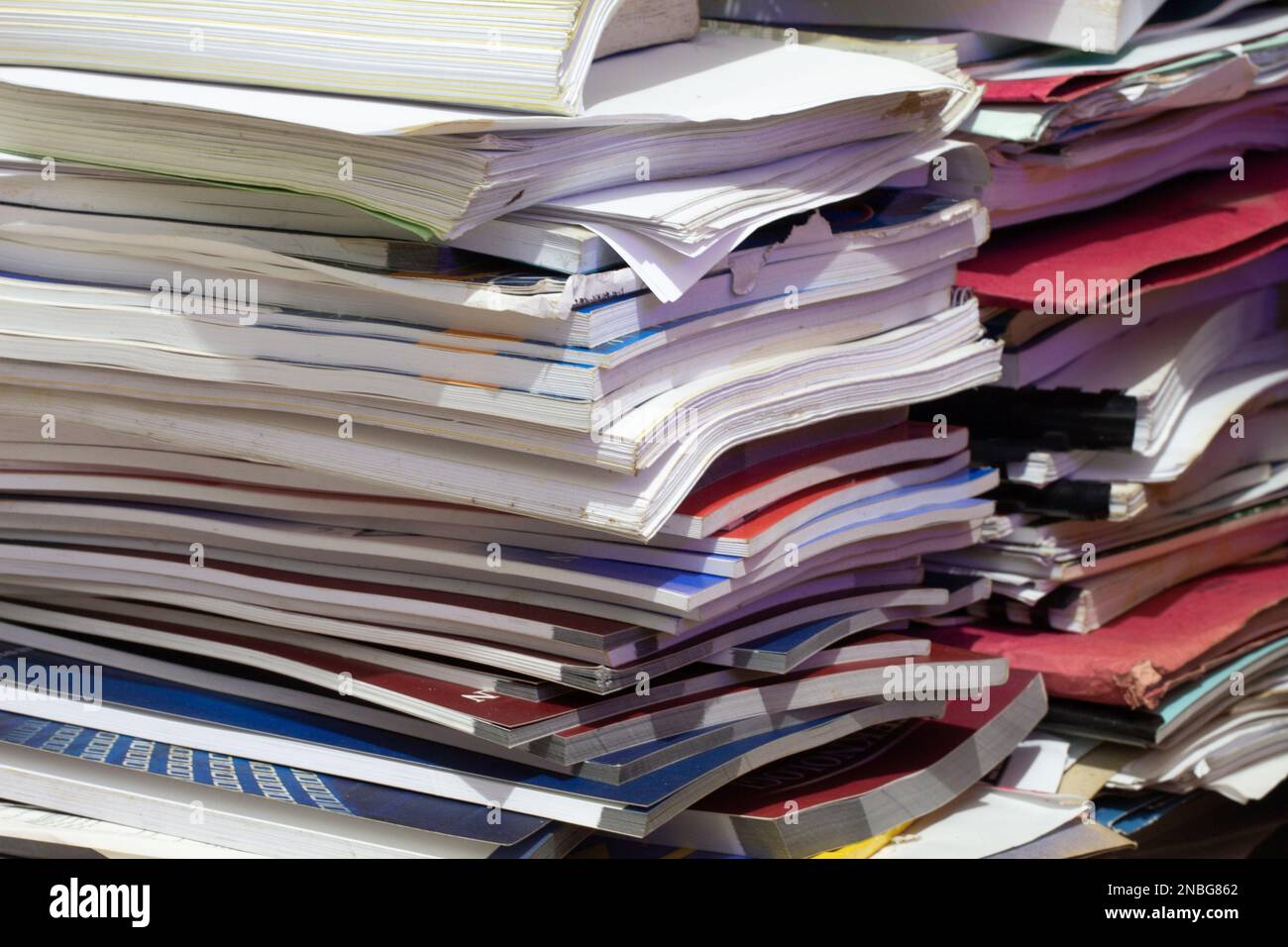 piles of books, magazines and waste paper. paper recycling Stock Photo