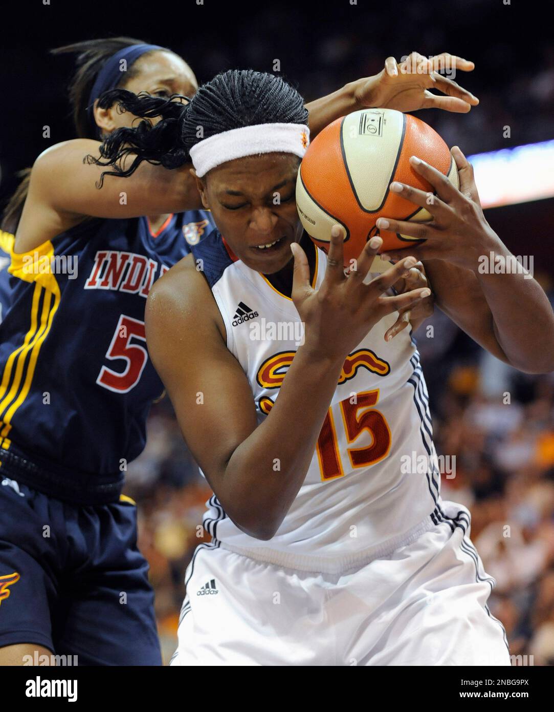 Connecticut Sun's Asjha Jones, right, fights to control the ball in ...
