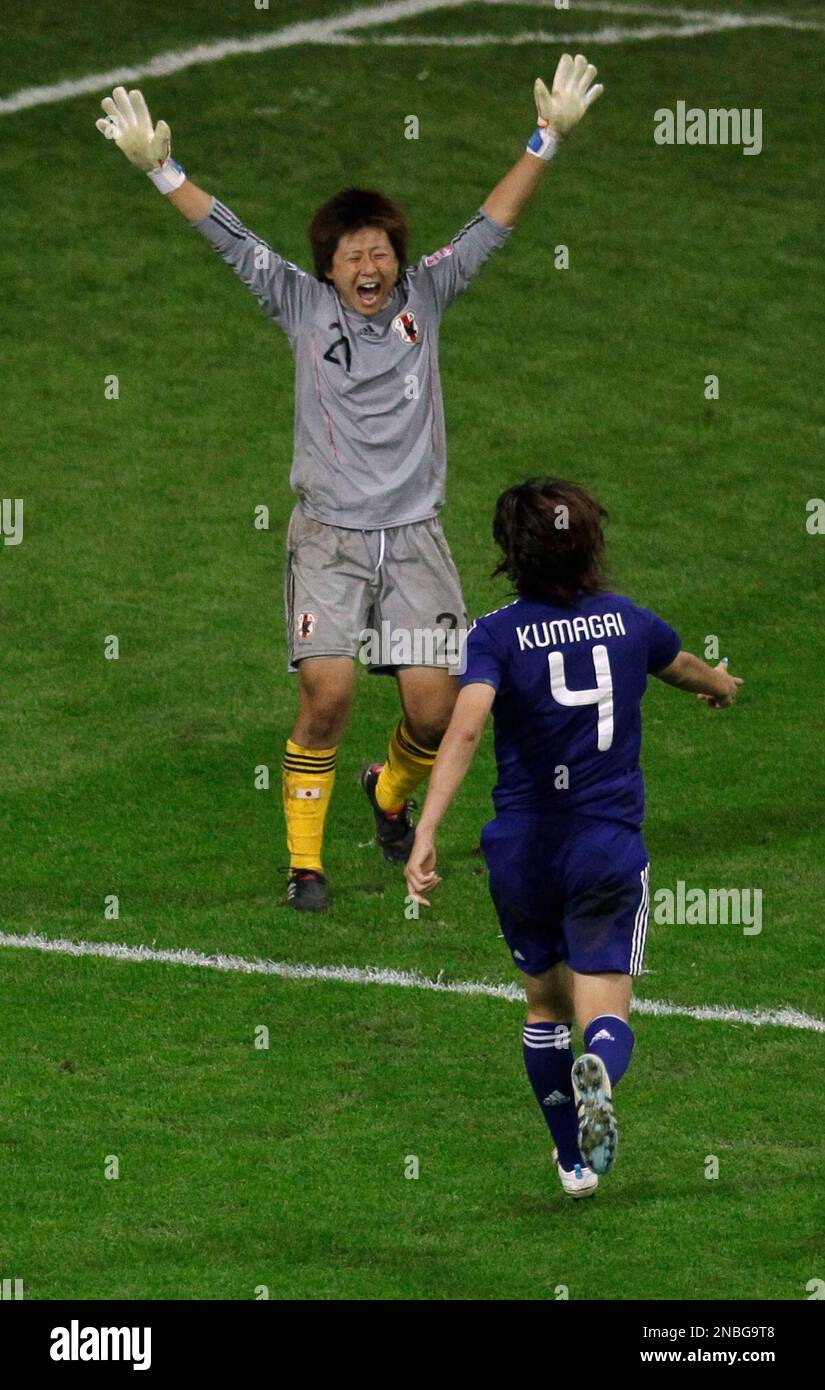 Japan goalkeeper Ayumi Kaihori, left, and Saki Kumagai celebrate
