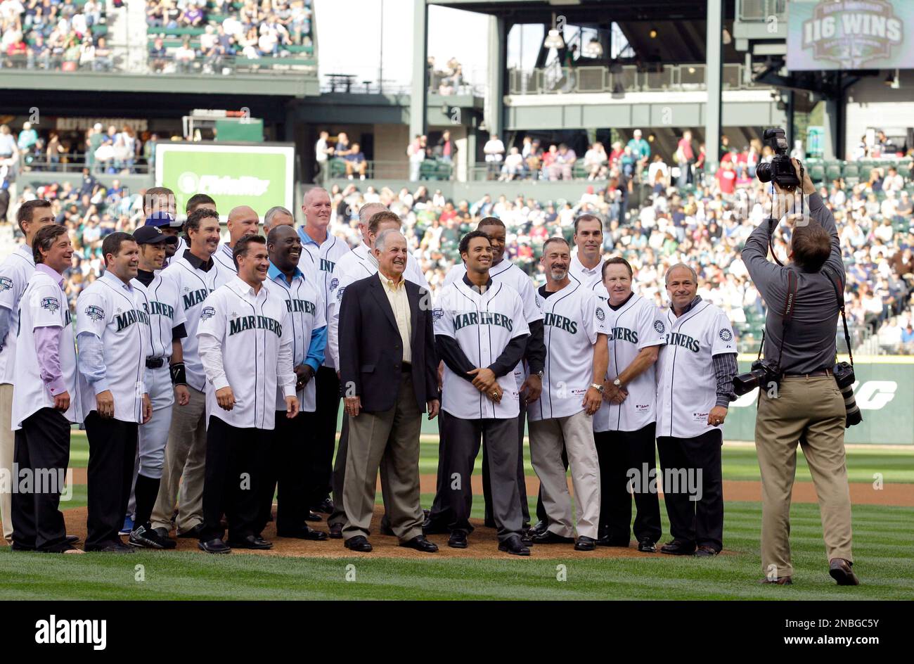 Former Seattle Mariners players Edgar Martinez, facing, greets Ken Griffey  Jr. (24) as they prepare to throw out ceremonial first pitches during the  MLB All-Star baseball game in Seattle, Tuesday, July 11