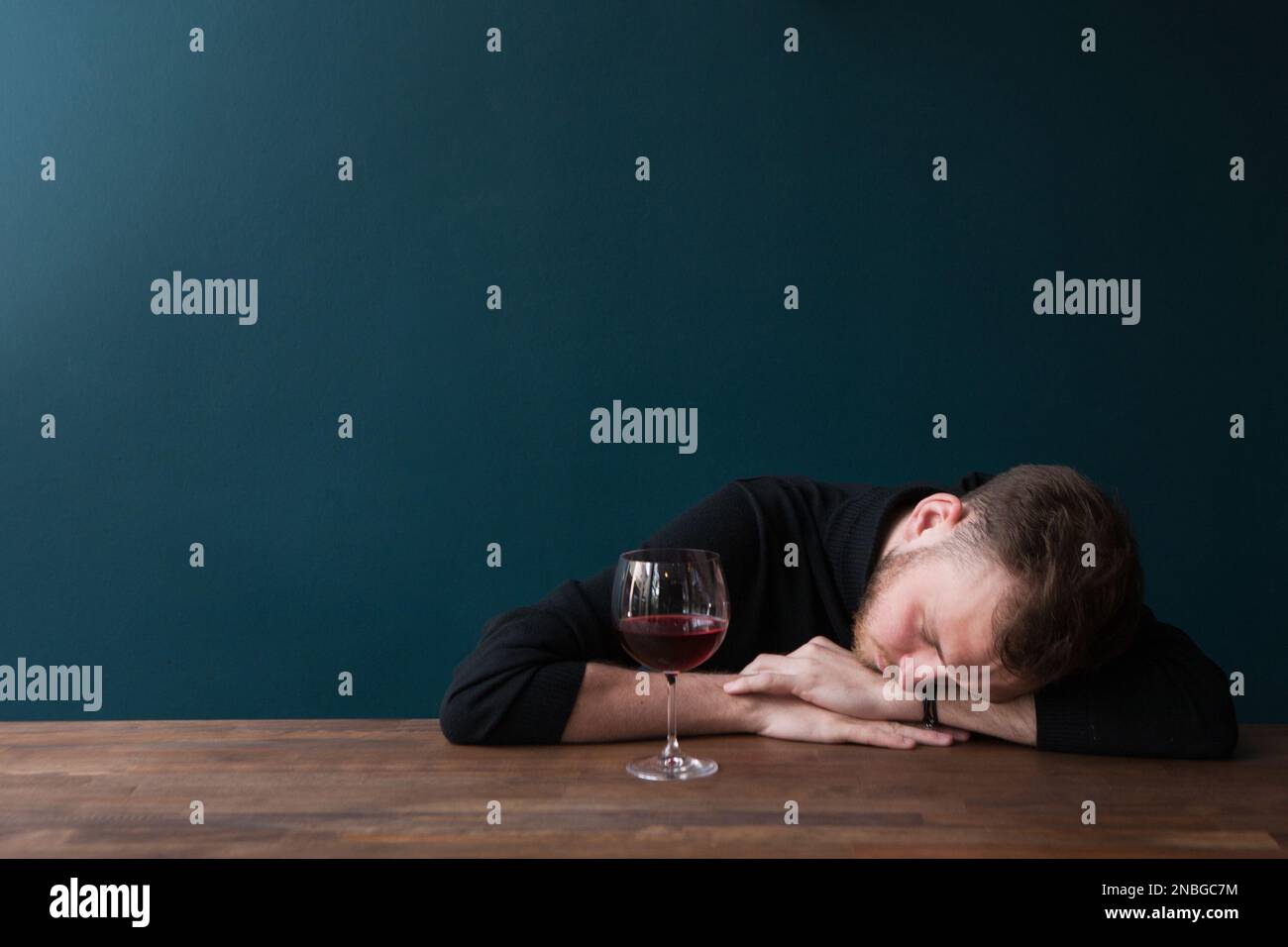 Drunk young male sleeping in bar. Unlucky date Stock Photo Alamy