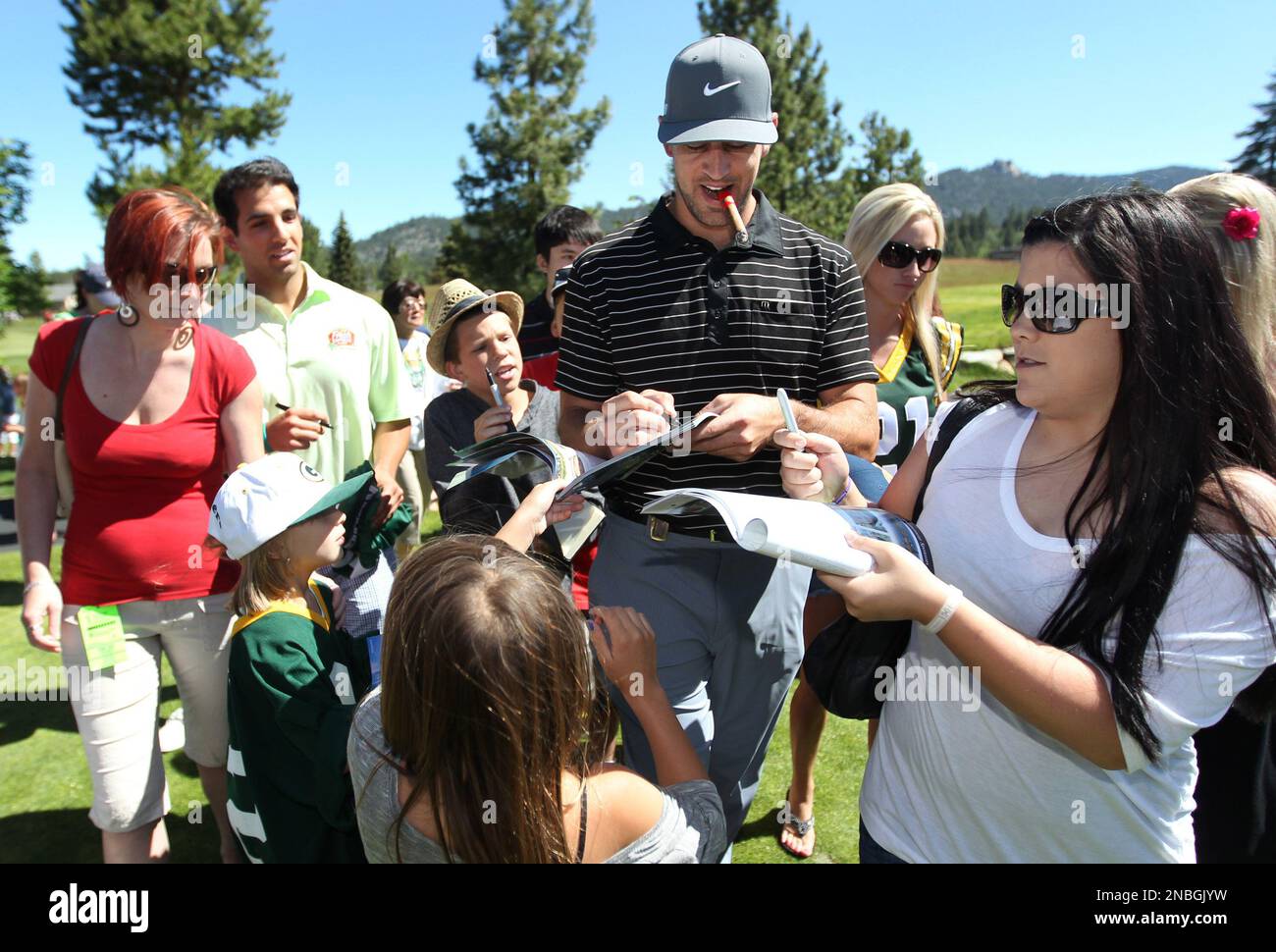 Green Bay Packers quarterback Aaron Rodgers signs autographs during a ...