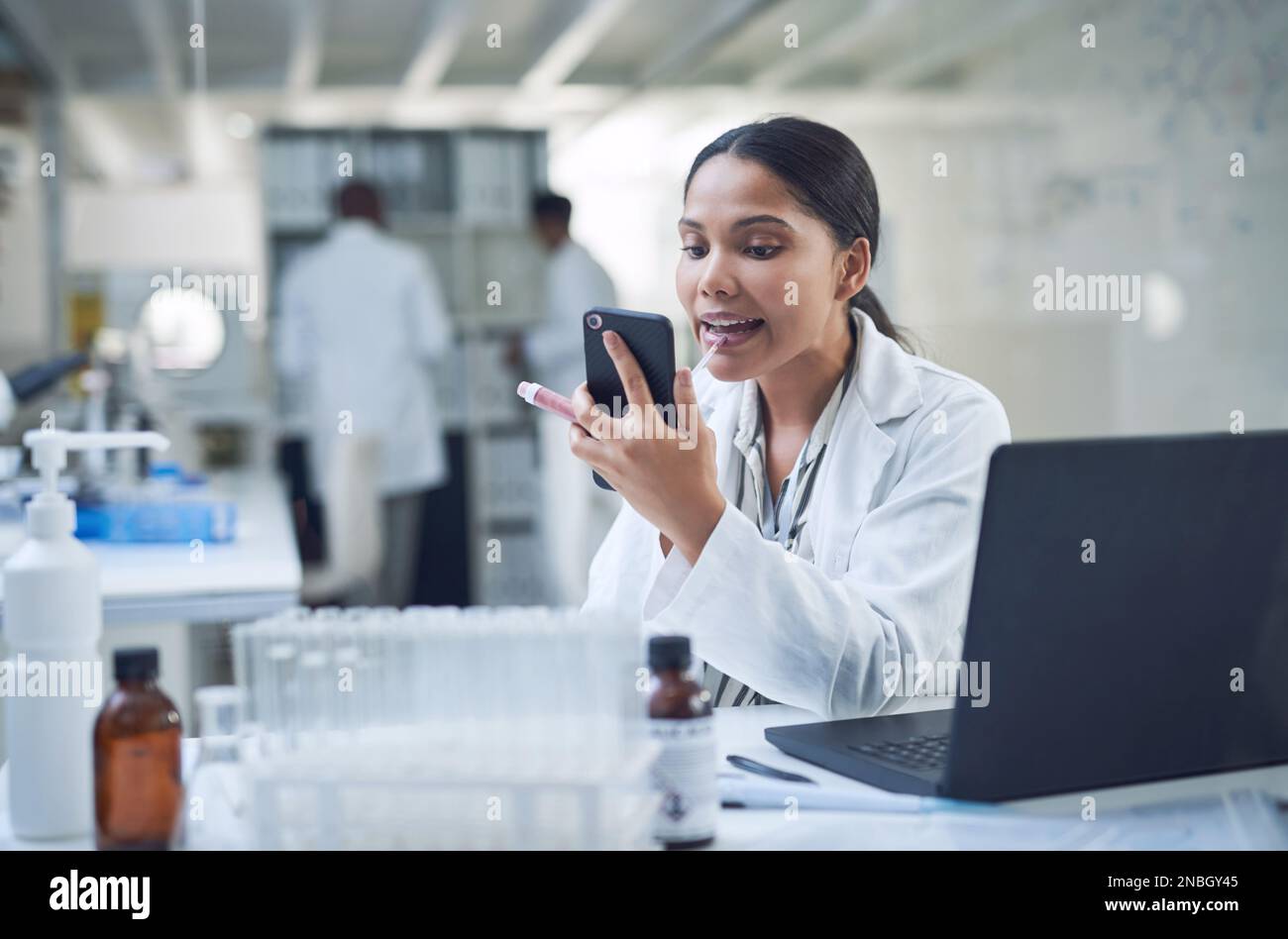 The perks of being a cosmetic chemist. a young scientist applying