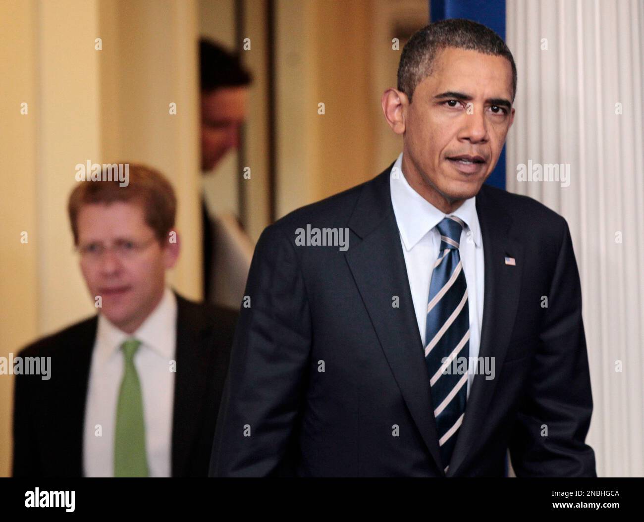 President Barack Obama, followed by White House Press Secretary Jay ...