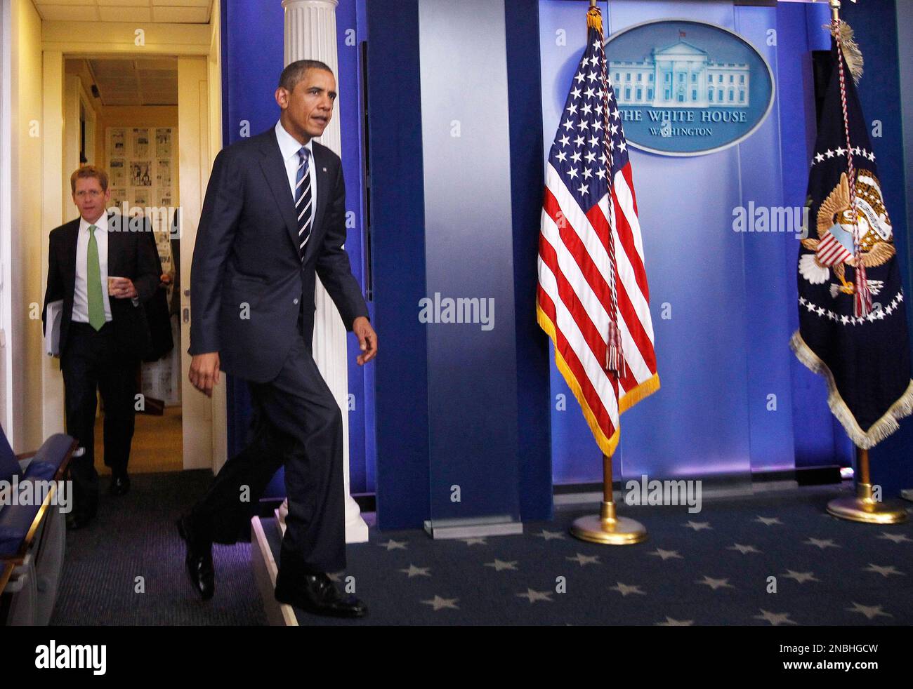 President Barack Obama, followed by White House Press Secretary Jay ...