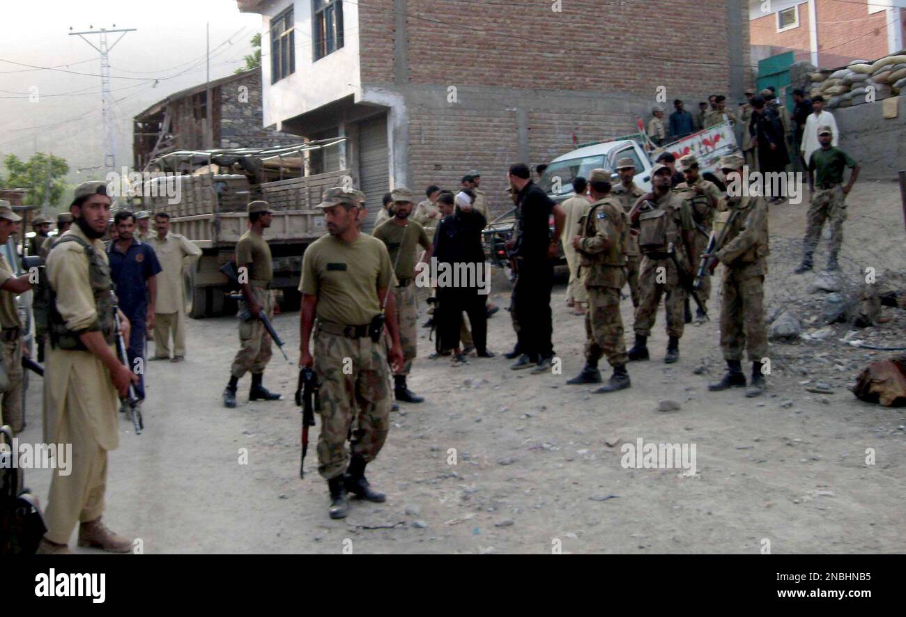 Troops of the Pakistan army and other security forces, gather in Nusrat ...