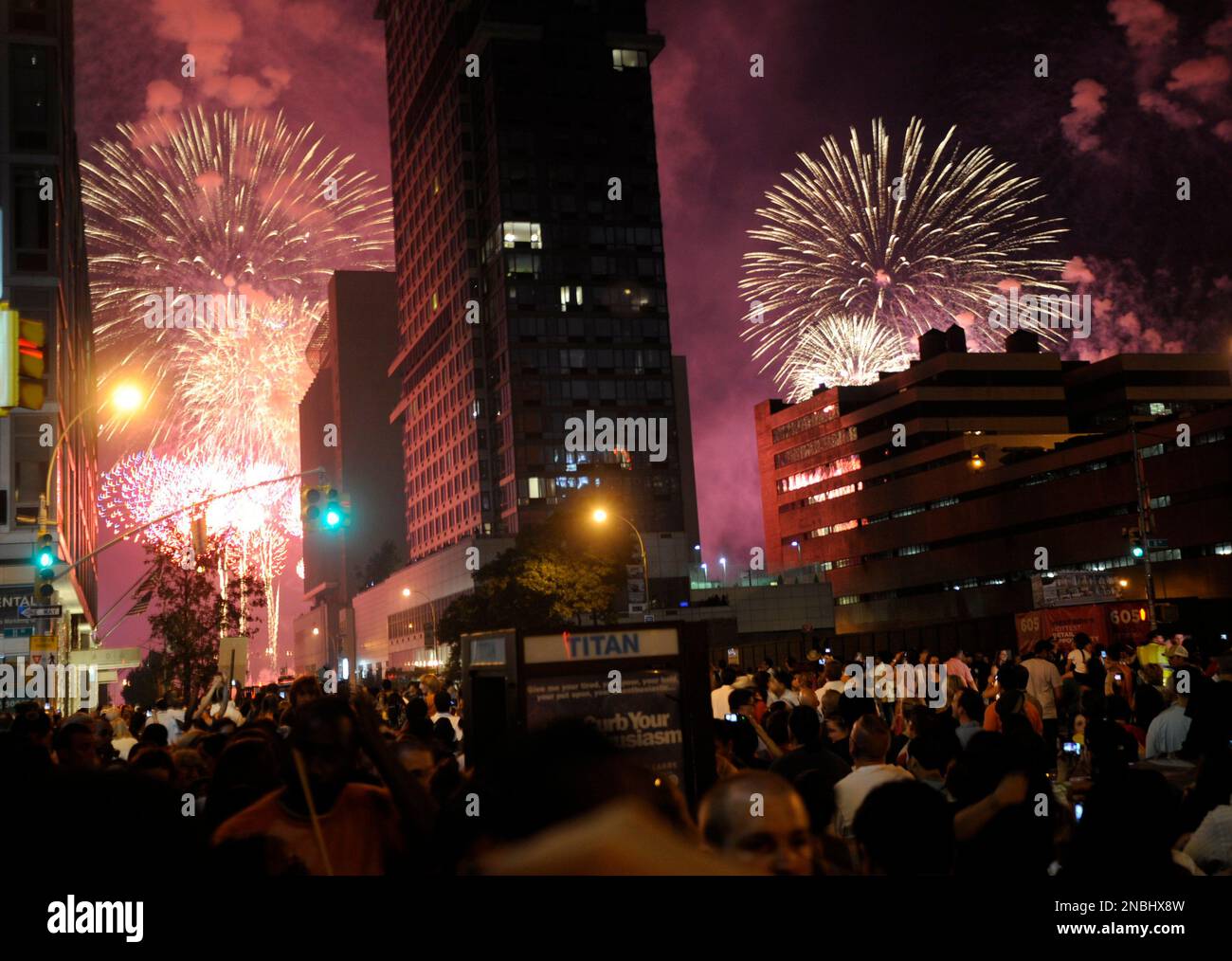 Spectators watch fireworks explode over the Hudson River from 42nd