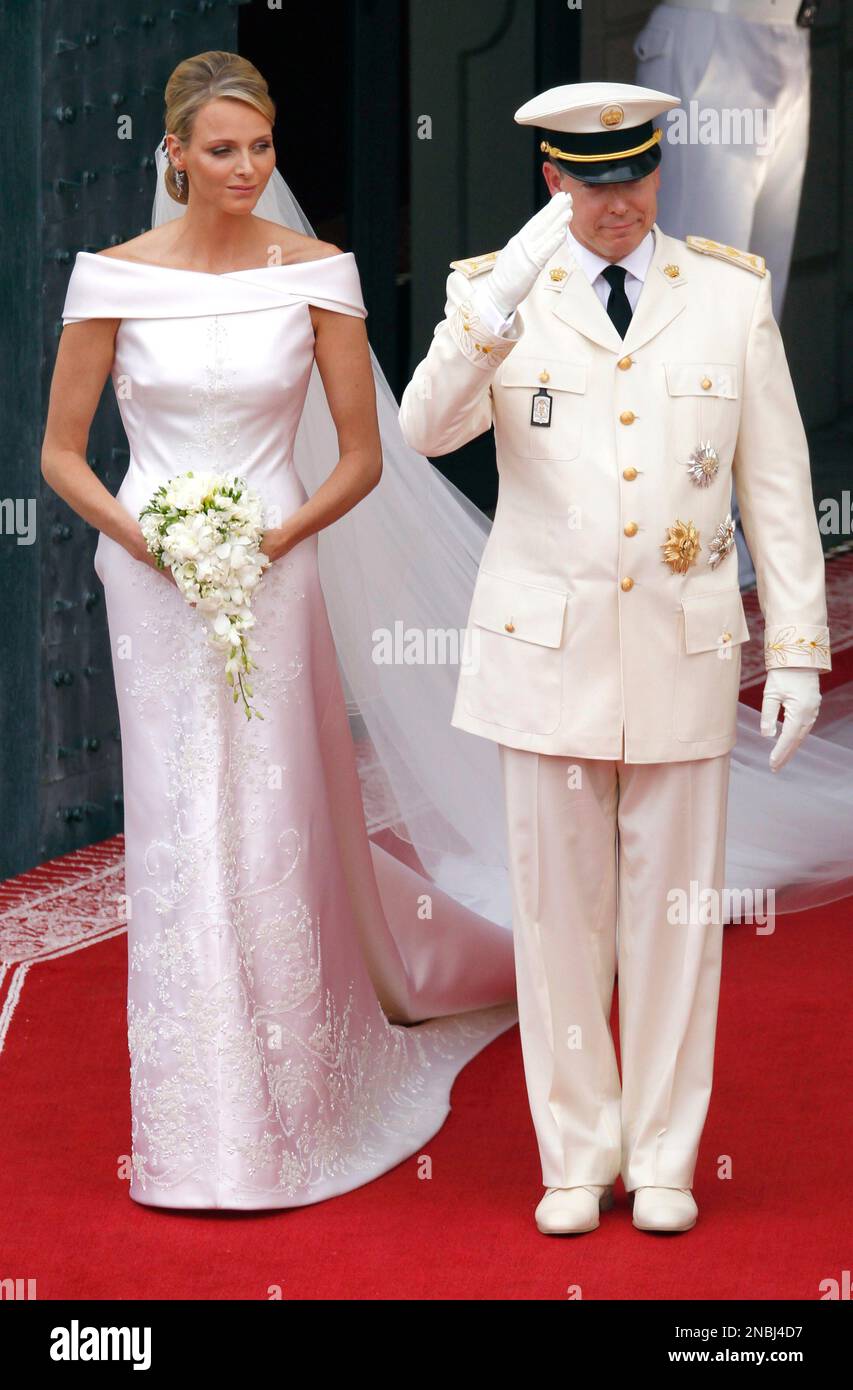 Monaco's Prince Albert II and Princess Charlene leave after the