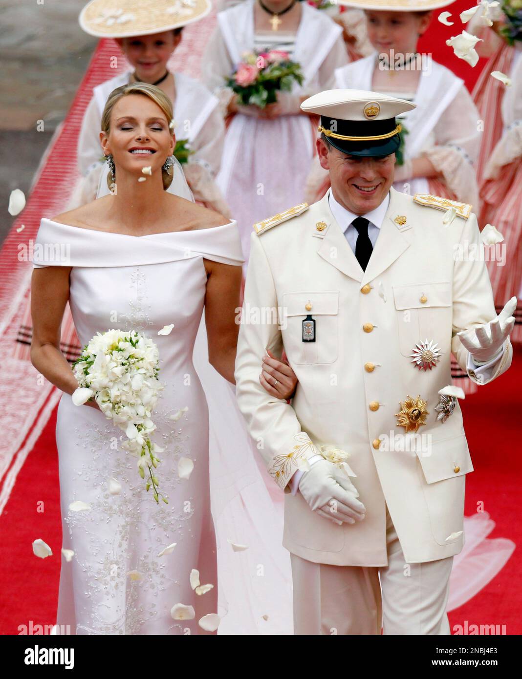 Monaco's Prince Albert II and Princess Charlene leave after the