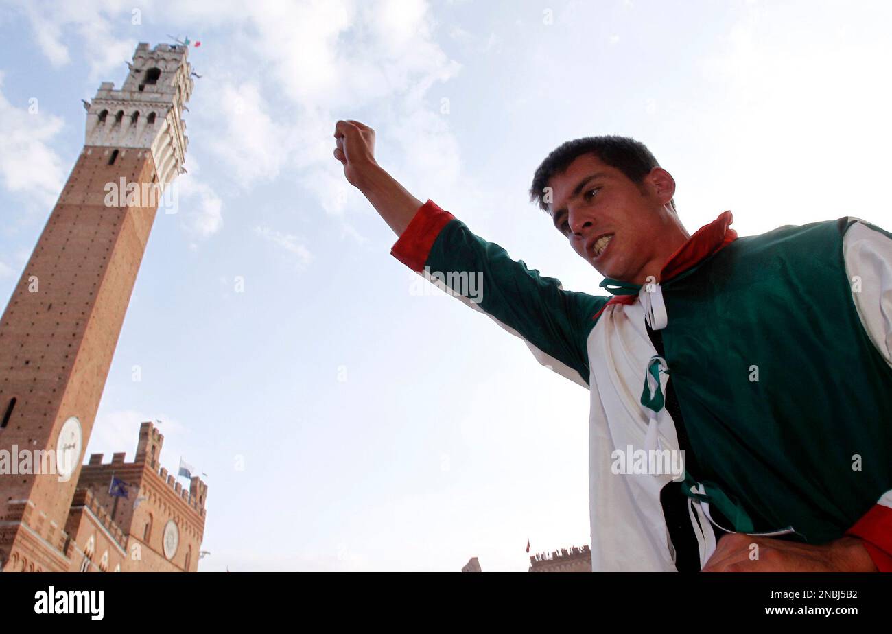 Rider Giovanni Atzeni of the Oca (Goose) neighborhood, celebrates after