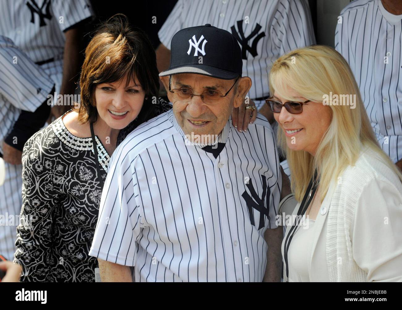 Former New York Yankees catcher Yogi Berra poses with Kay Mercer