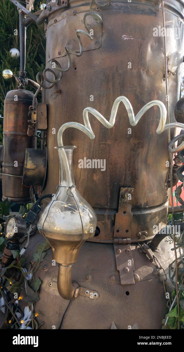 detail of copper tank and glass flask from an old distillery magician retro machinery Stock Photo