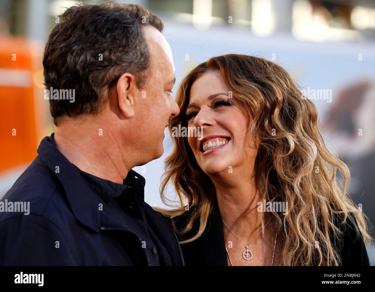 Cast members Tom Hanks, left, and Rita Wilson arrive at the premiere of "Larry  Crowne" in