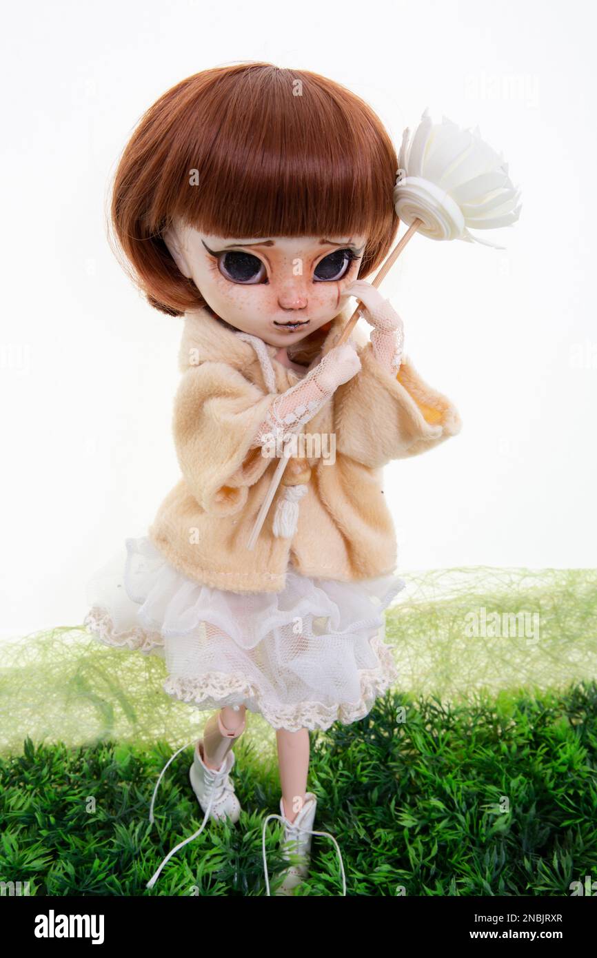 doll expressive face big eyes scary plastic face standing Stock Photo Alamy