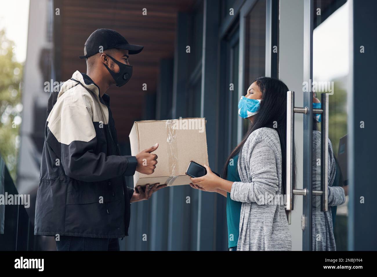Keeping our safety standards up and our delivery time low. a masked ...