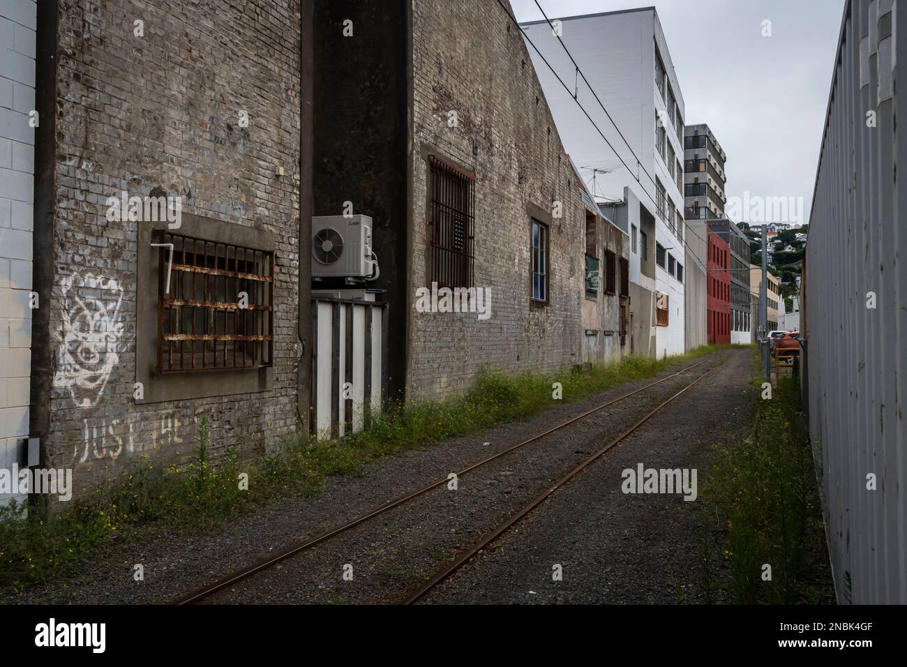 Old, industrial buildings beside railway track, Wellington, North
