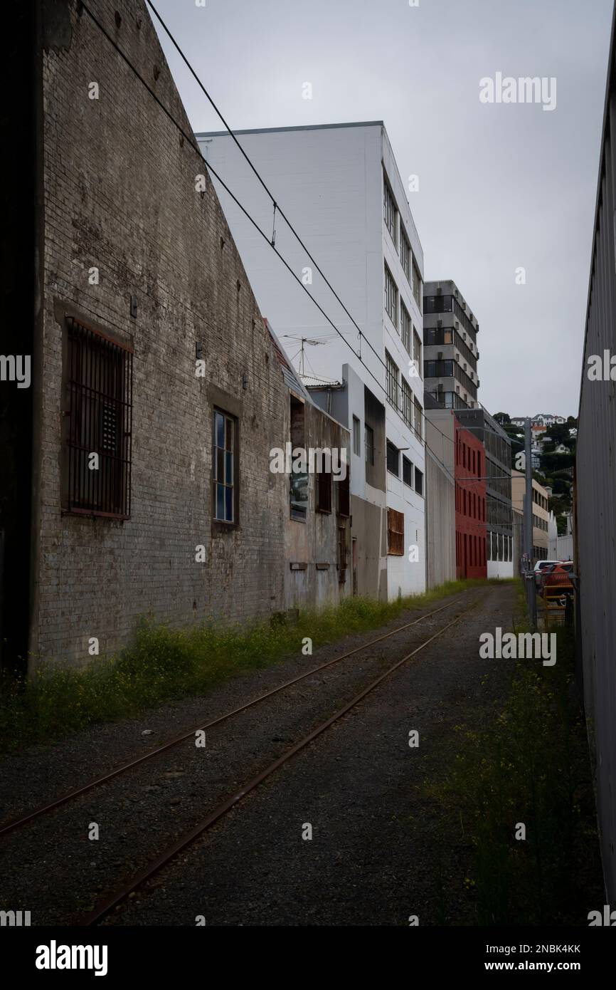 Old, industrial buildings beside railway track, Wellington, North