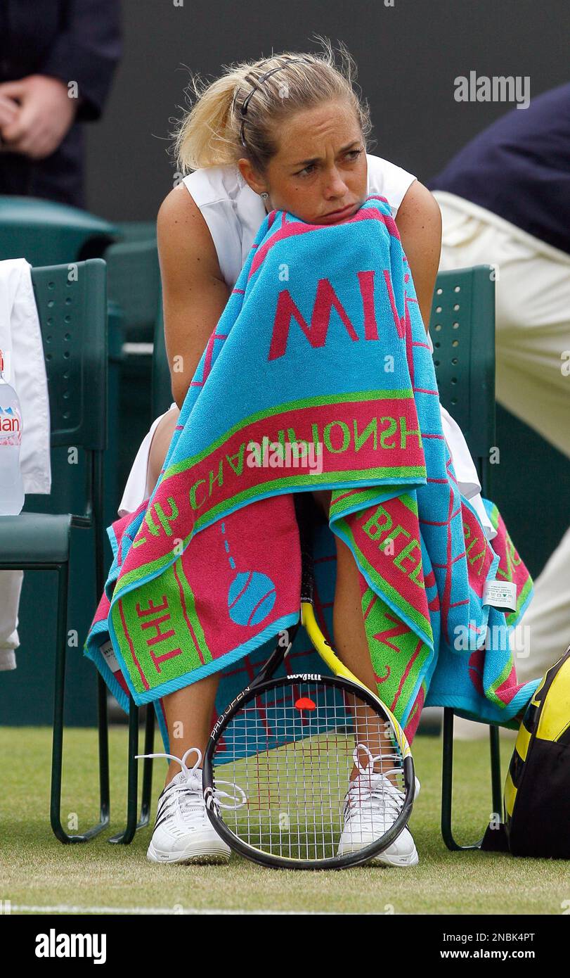 Klara Zakopalova of the Czech Republic looks dejected after being defeated  by Russia's Maria Sharapova in their match at the All England Lawn Tennis  Championships at Wimbledon, Saturday, June 25, 2011. (AP