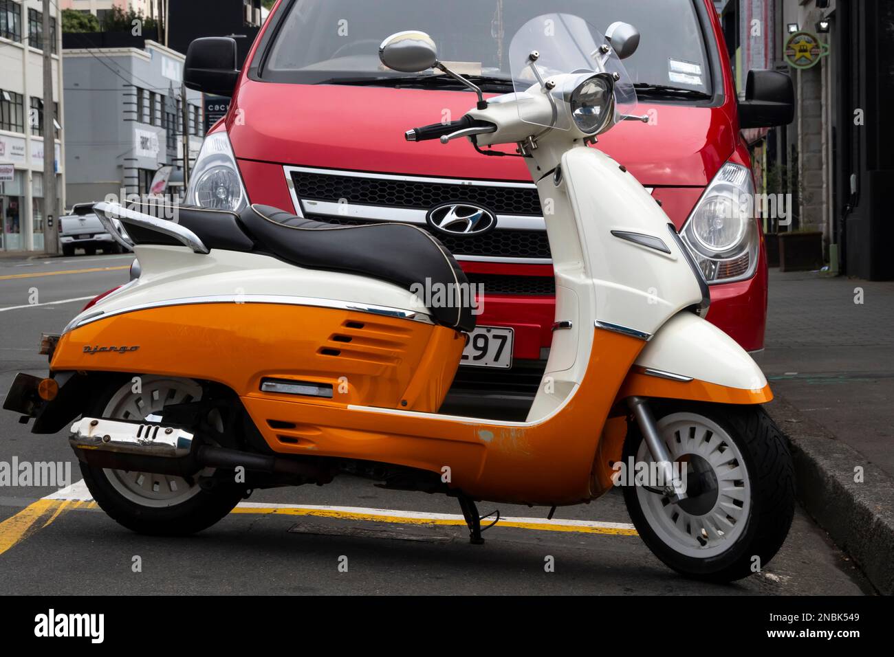 Scooter and car parked in street, Wellington, North Island, New Zealand