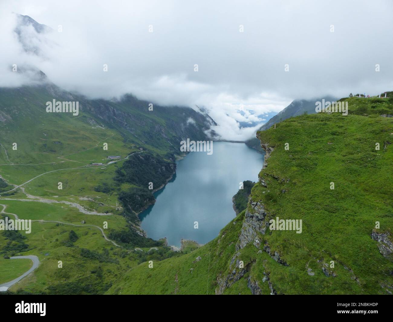 An aerial view of lake surrounded by greenery mountains Stock Photo - Alamy