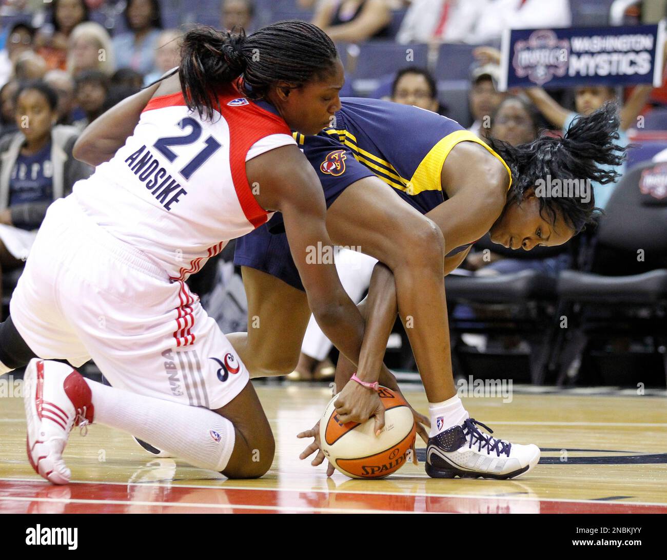 Washington Mystics' Nicky Anosike (21) and Indiana Fever's Shyra Ely