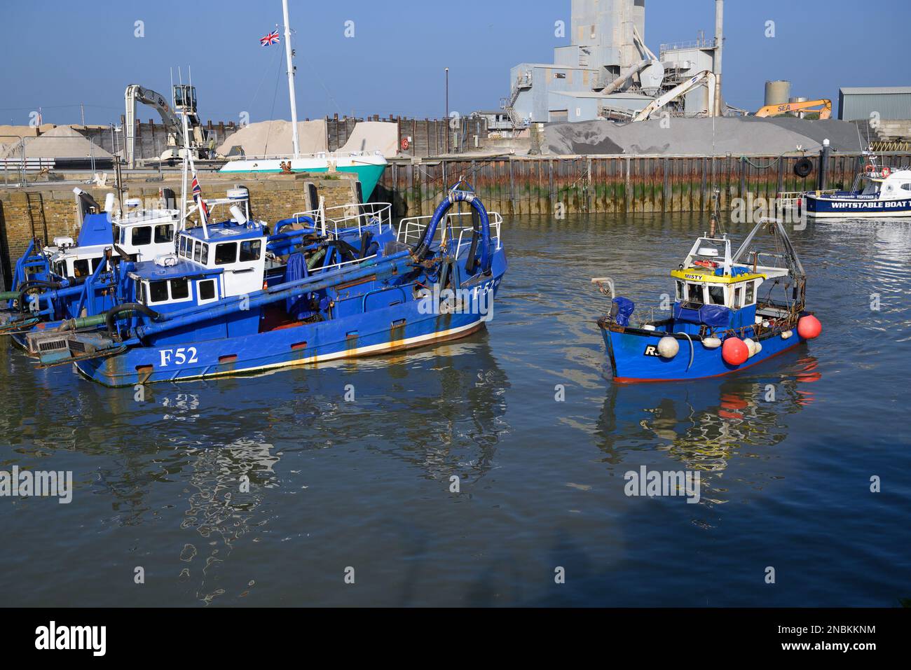 Small fishing boat entering harbour hi-res stock photography and images ...