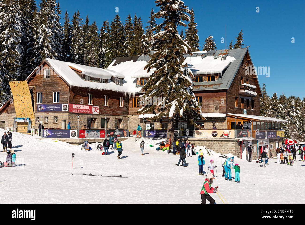 People, visitors, and skiers enjoying the sunny Winter day at Aleko Hut in Vitosha Mountain above Sofia, Bulgaria, Eastern Europe, Balkans, EU Stock Photo