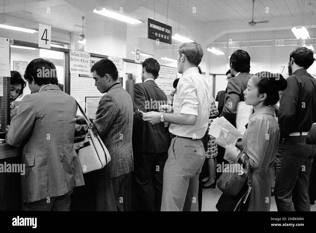 Japanese citizens holding valid passports are lined up at the windows