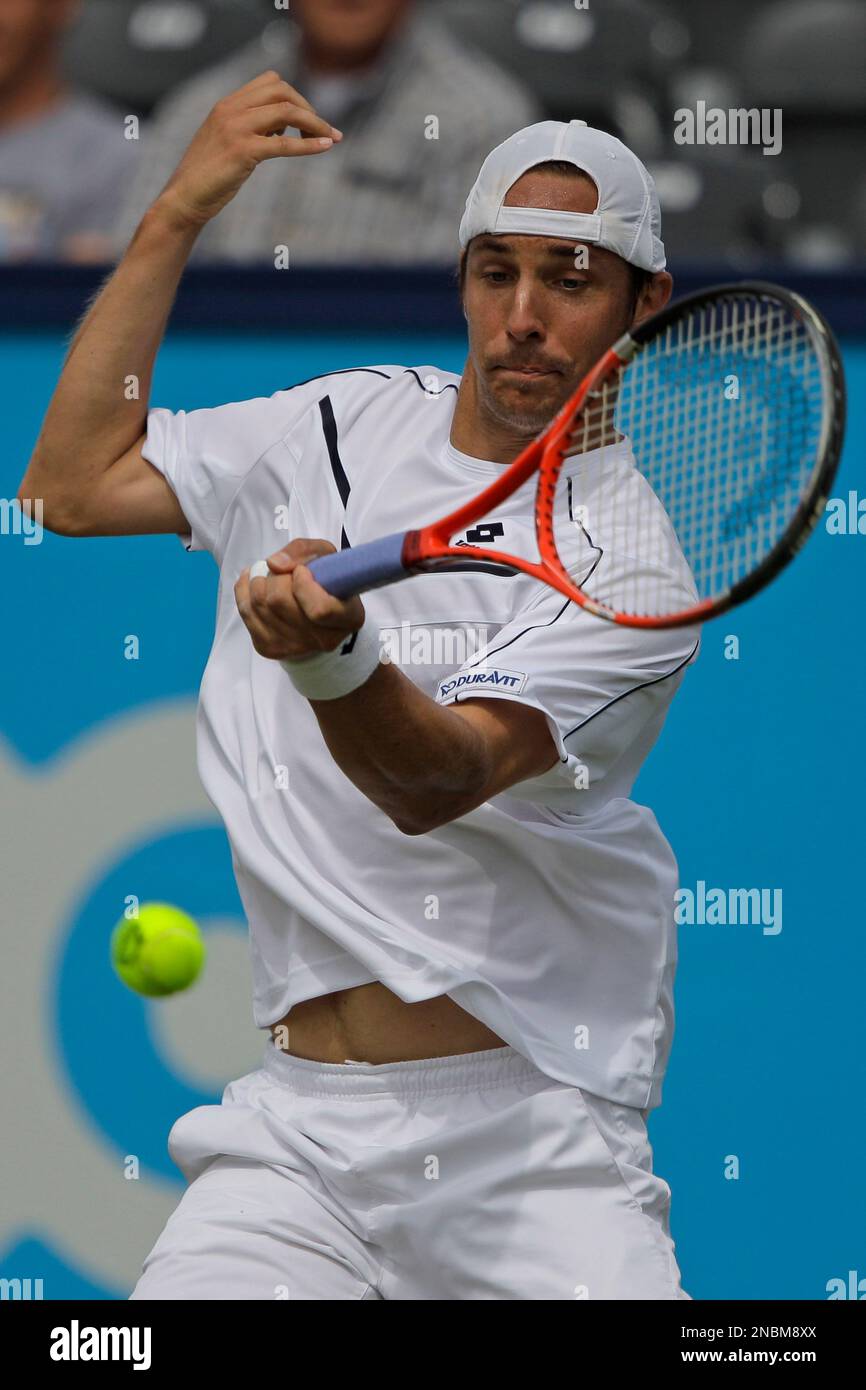 Denis Gremelmayr of Germany returns against Marcos Baghdatis of Cyprus in  the men's singles quarter final of the Unicef Open tennis tournament in  Rosmalen, central Netherlands Friday June 17, 2011. Gremelmayr lost