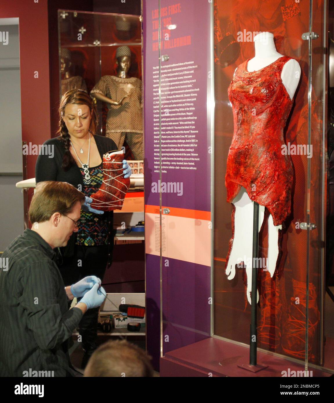 Exhibitions chief preparetor Andre Septavec and director of exhibitions  Shelby Morrison put the famous meat dress and boots, worn on stage by Lady  Gaga during her acceptance for Best Video of the