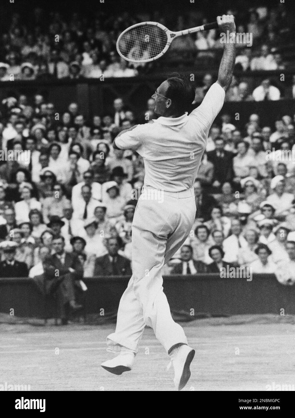 Jean Borotra, the “Bounding Basque,” France, shown in play in a second  round men's doubles championship match at Wimbledon, England on June 26,  1952. His partner was Bernard Destremeau, France. They were