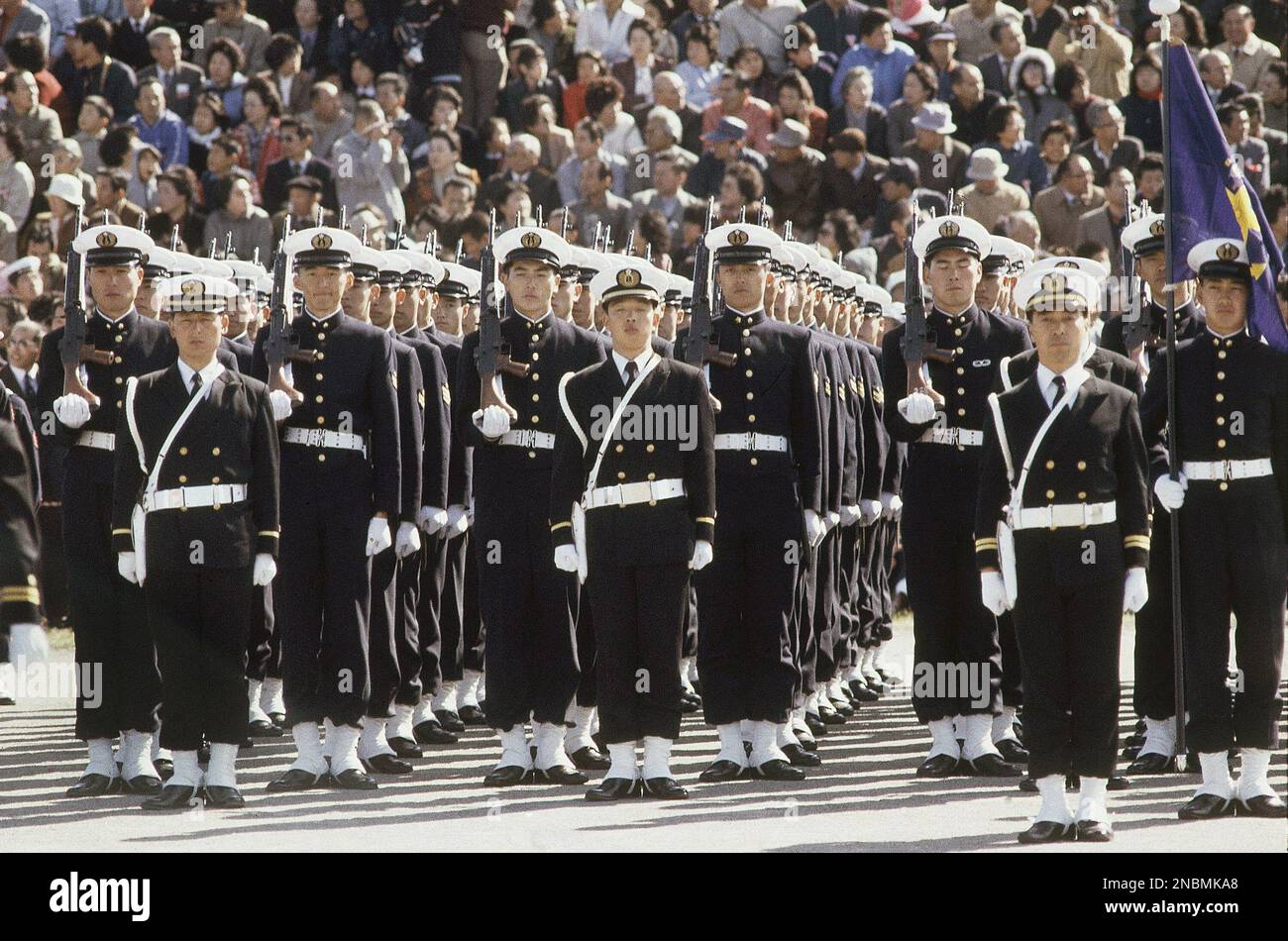 Japan’s ground self-defense forces military parade goes past a ...