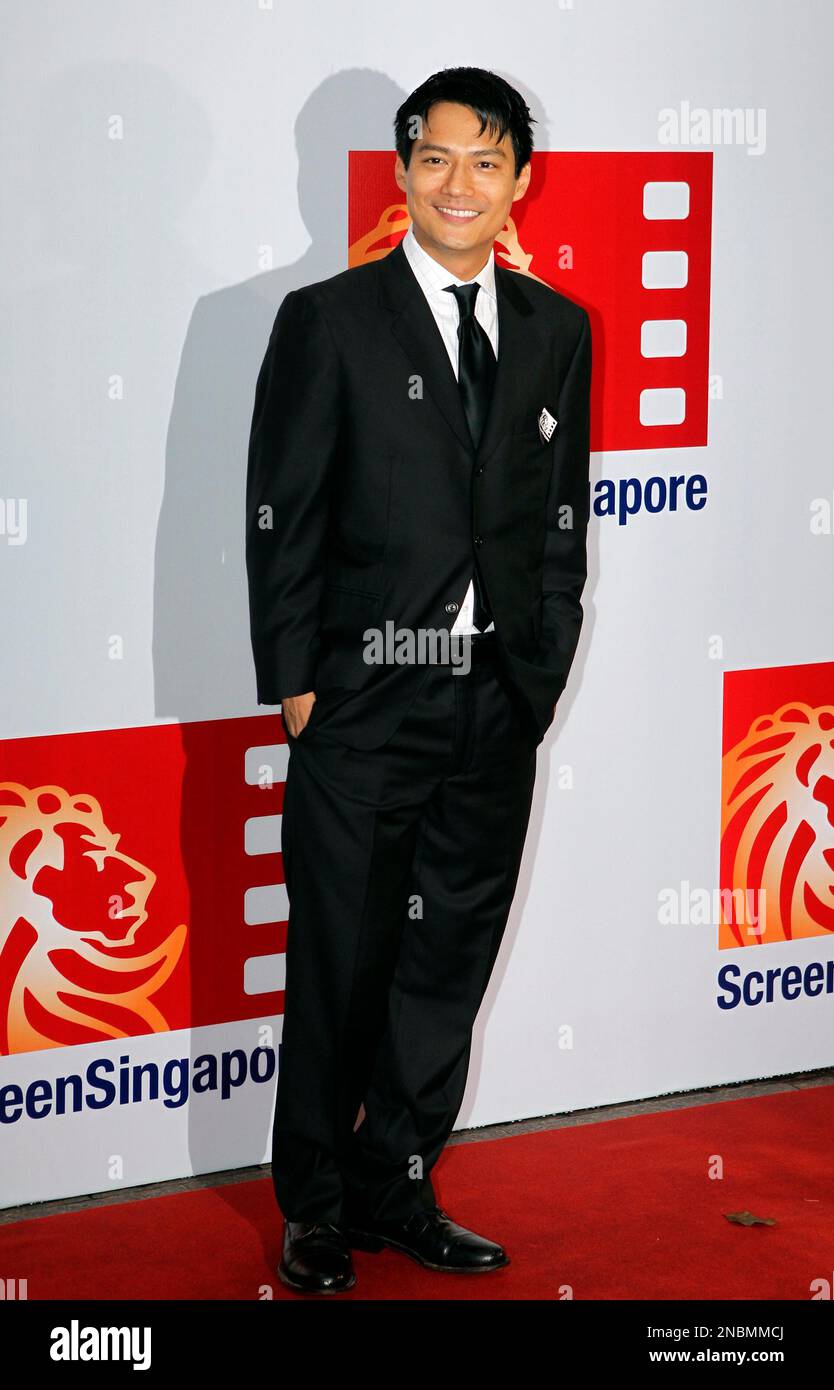 American actor Archie Kao waves to photographers during the red carpet ...