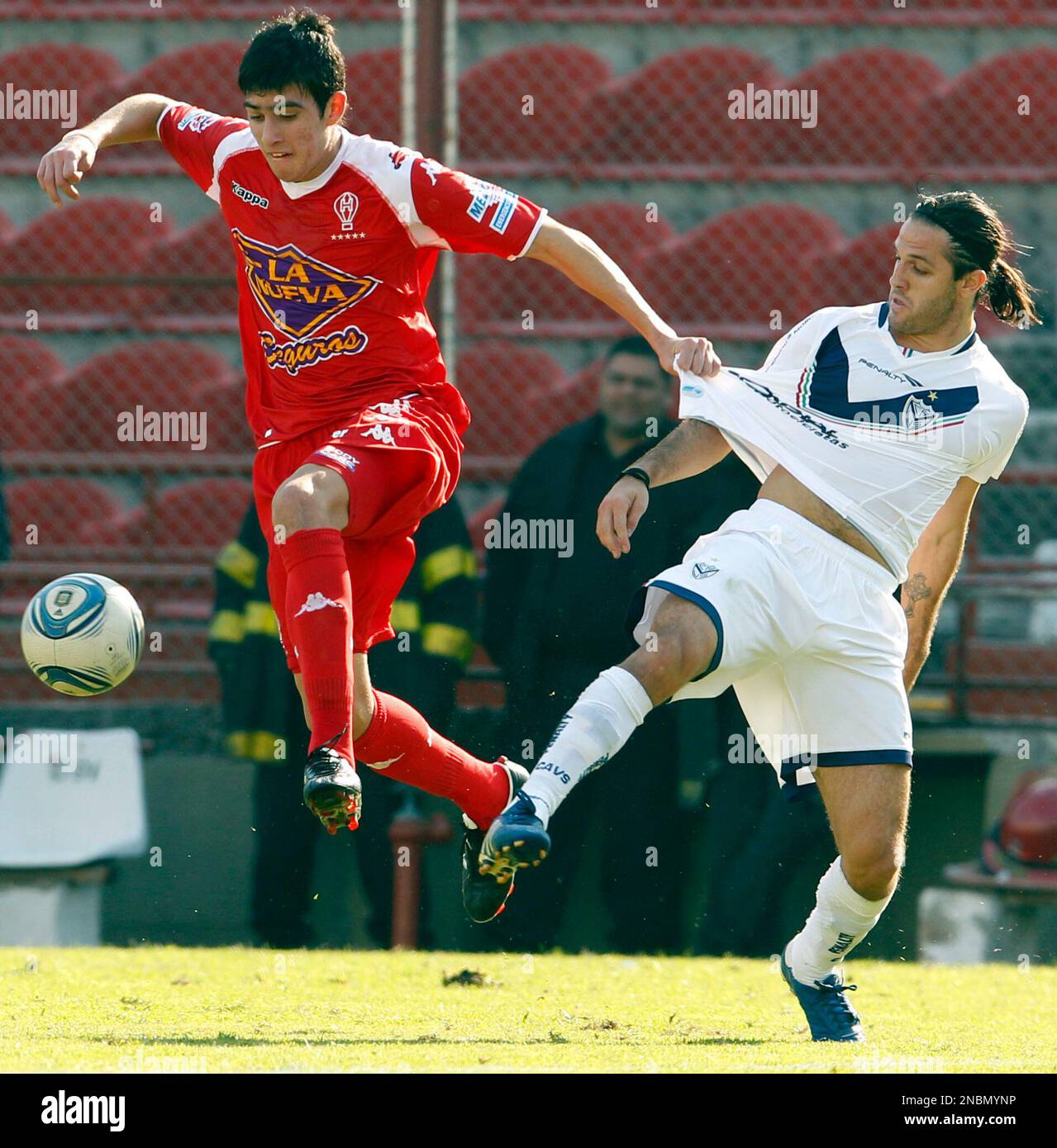 Velez Sarsfield s Juan Manuel Martinez right fights for the ball with Huracan s Rodrigo Battaglia at an Argentine league soccer match in Buenos Aires Argentina Sunday June 12 2011. AP Photo Natacha Pi...