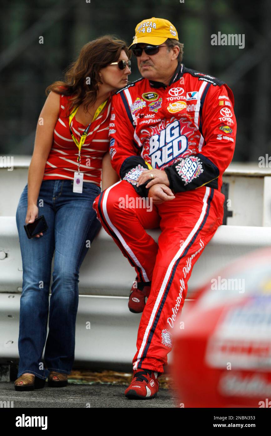 Driver Mike Skinner and wife, Angie Skinner, wait on the wall during  qualifying for Sunday's NASCAR Sprint Cup Series 5-hour ENERGY 500 auto  race, Saturday, June 11, 2011, in Long Pond, Pa. (