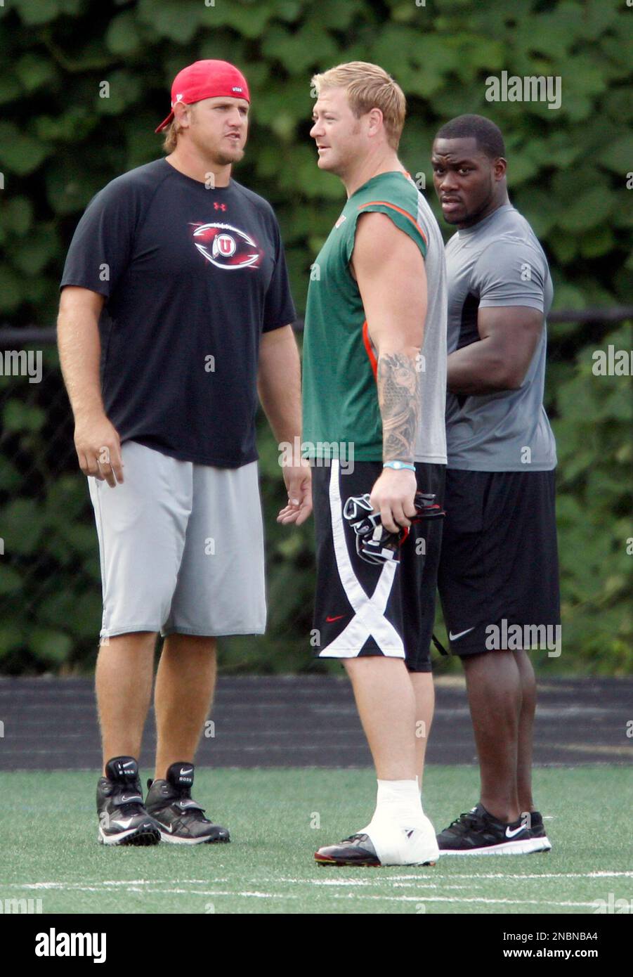 Carolina Panthers players Jeremy Shockey, center, Jon Beason, right