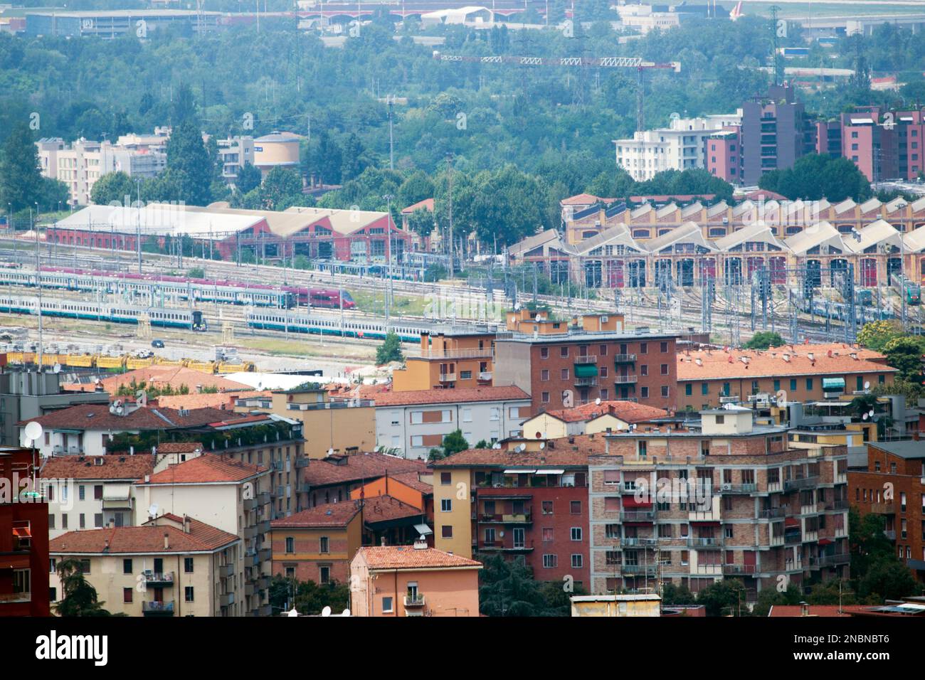 Aerial view of Bologna, city in Italy,  known for its Spanish-style red tiled rooftops, medieval defensive towers and home to the oldest university. Stock Photo