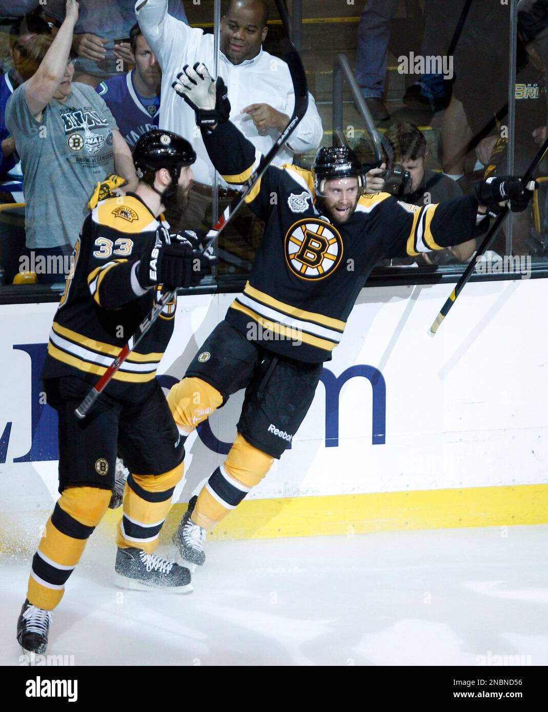 Boston Bruins center Rich Peverley, right, celebrates his goal with defenseman Zdeno Chara (33