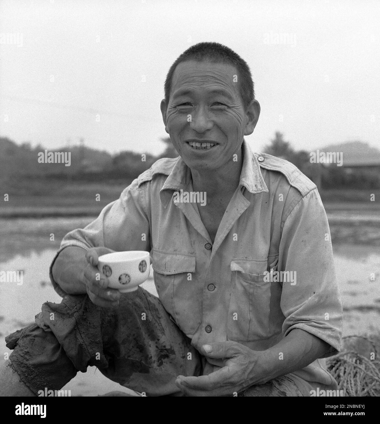 A Japanese rice farmer takes a tea break, June 27, 1969. (AP Photo