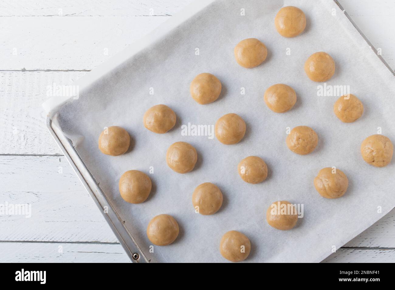 Overhead shot of a group of items for baking Christmas Cookies surrounding  an empty cookie sheet. Horizontal format on a rustic Stock Photo - Alamy