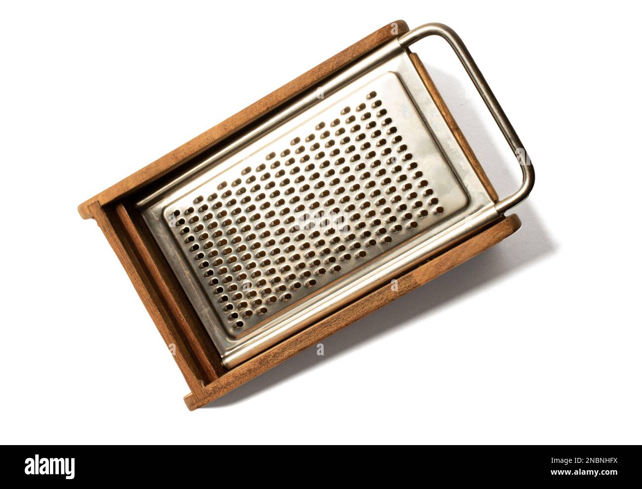 https://c8.alamy.com/comp/2NBNHFX/cheese-grater-food-classic-wooden-and-metal-kitchen-on-white-backgroundvintage-kitchen-utensil-on-white-isolated-copyspaceshredder-overview-2NBNHFX.jpg