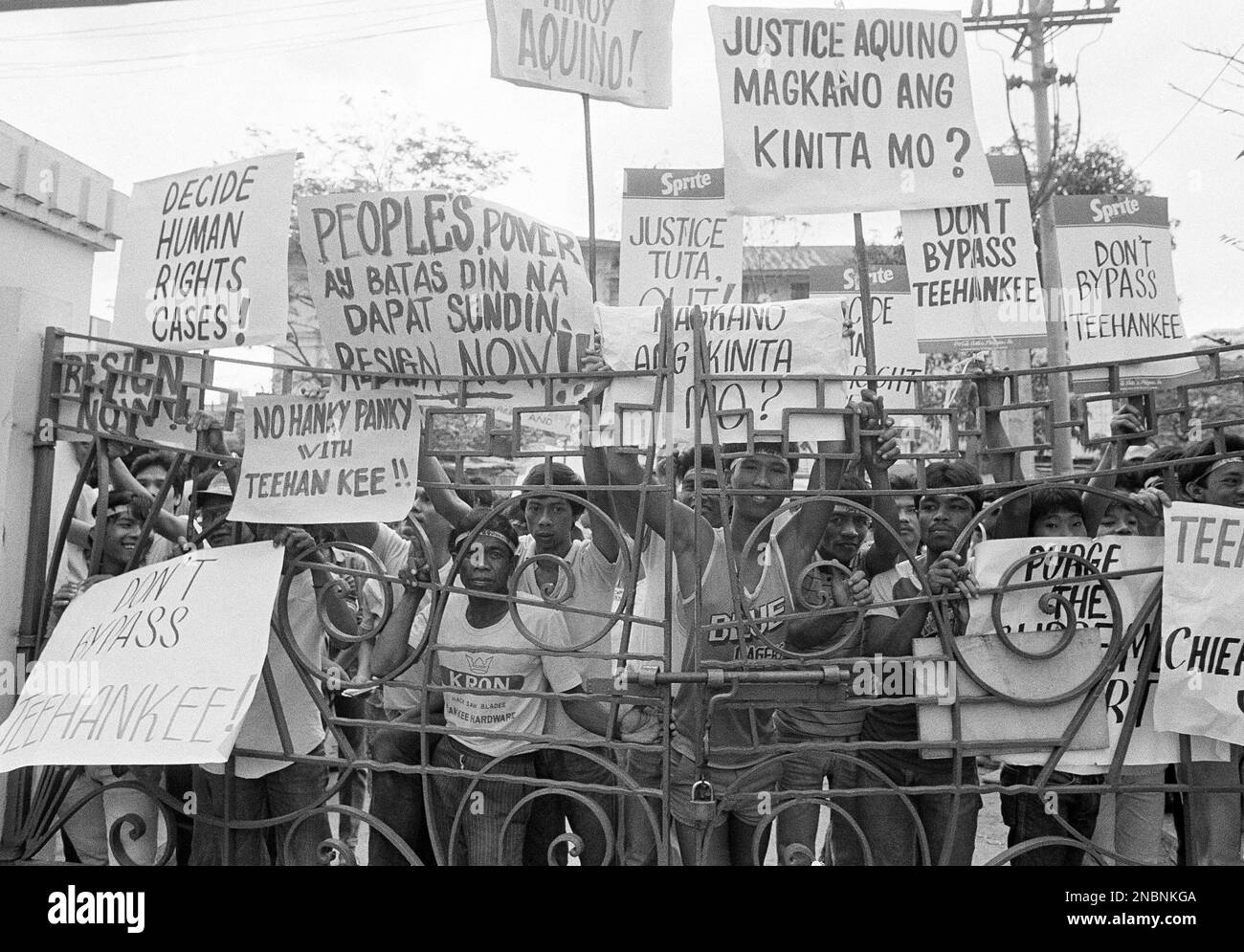 Demonstrators outside the Philippine Supreme Court carry signs urging ...
