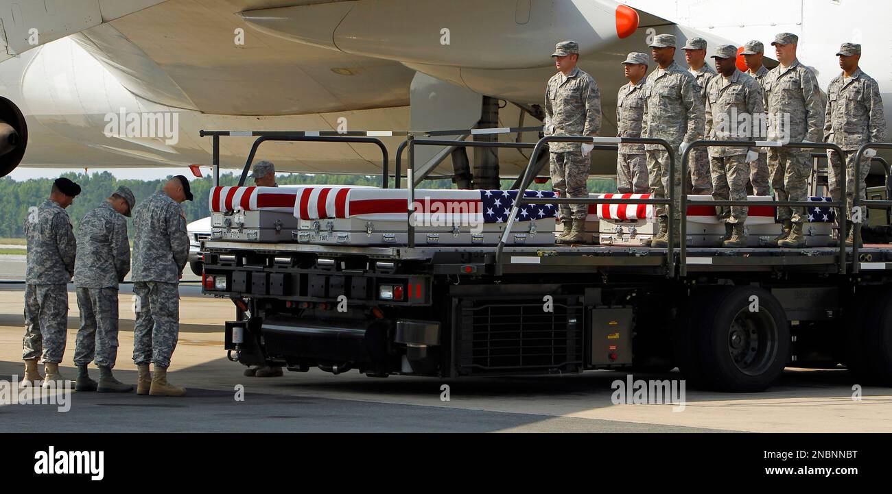 U.S. Army Chaplain Col. Scott H. Jensen, left says a prayer as U.S. Air ...