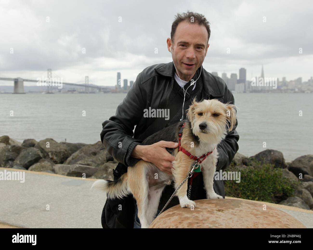 This May 16, 2011 photo shows Timothy Ray Brown, the only man ever known to  have been apparently cured from AIDS, with his dog, Jack, on Treasure  Island in San Francisco. Brown