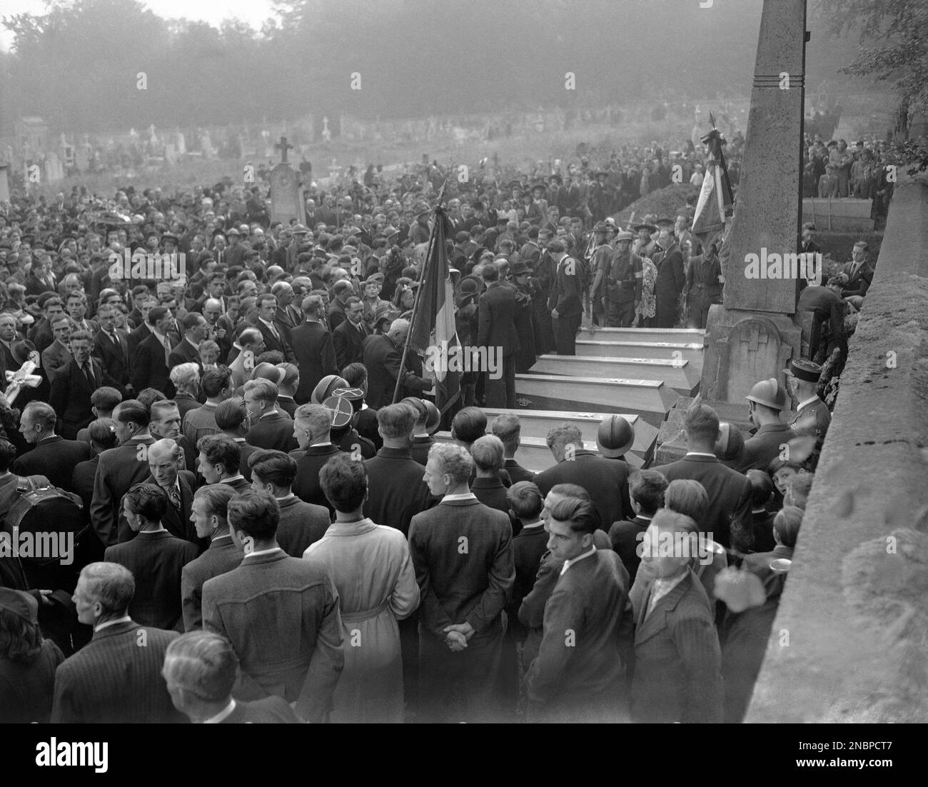 The crowds mass before the graveside of the 8 Polish boys in France on