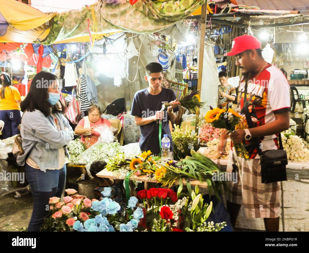 Manila, Philippines. 13th Feb, 2023. A female customer seen waiting for