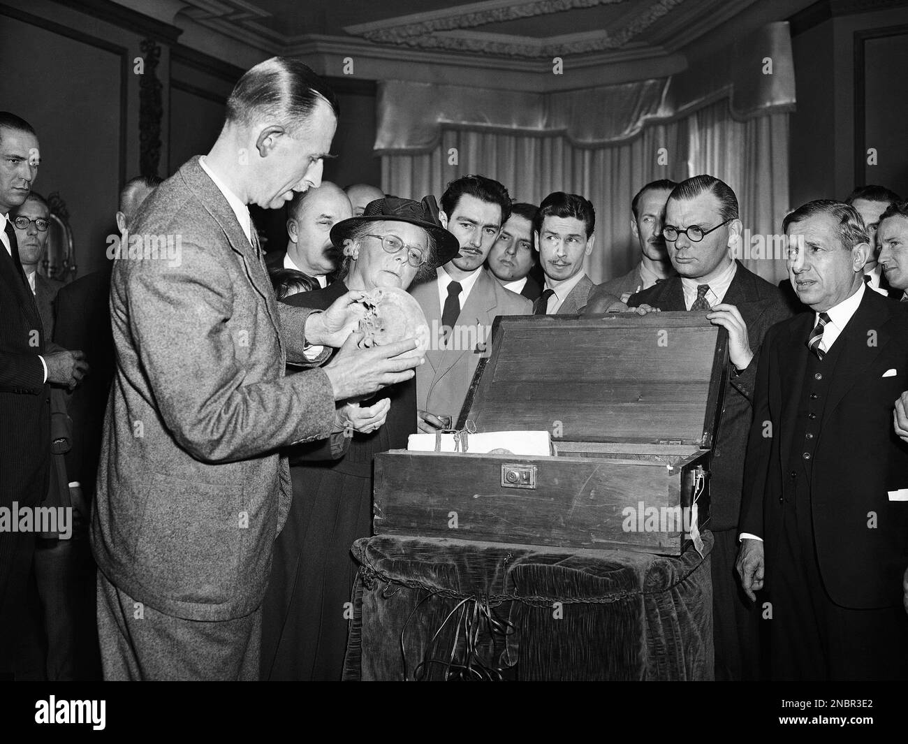 Artist Brian Fawcett, left, inspected bones brought to London from