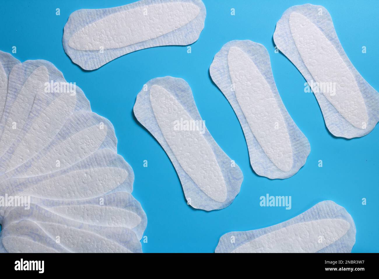 women's hygiene products, daily sanitary pads, space for text, cleanliness and freshness, women